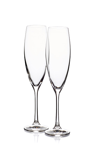 Two empty champagne glasses isolated on white background