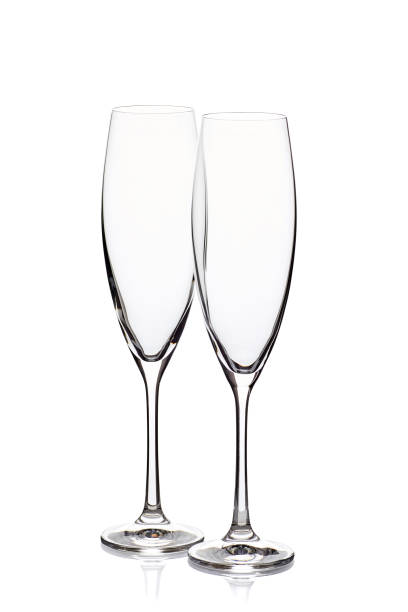Two empty champagne glasses on white stock photo