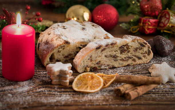 istock German Christmas Stollen decorated with cinnamon and oranges 879934680