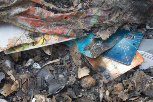 istock Close up of credit card in ashes. 879942490