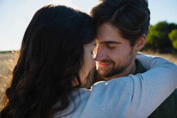 istock Close-up of couple embracing 879942804