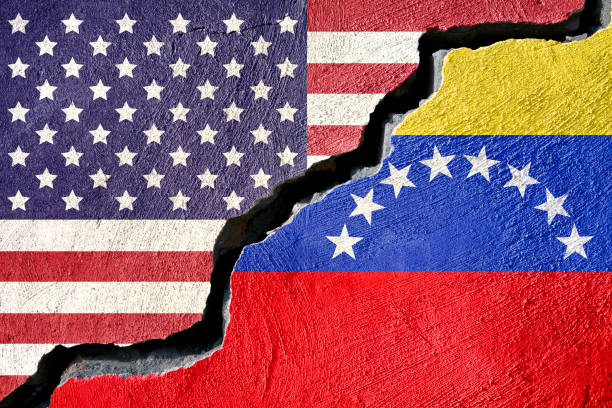 Concept american and Venezuela flag on cracked background stock photo