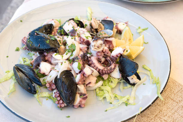 istock Sea salad with lemon 879943416