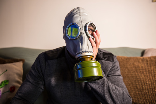 Civilian wearing nuclear gas mask during nuclear fallout