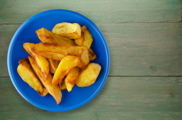 istock fry potatoes on a wooden background 879943838
