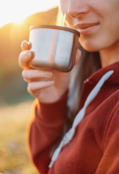 istock Woman drinking tea outdoor. 879946676