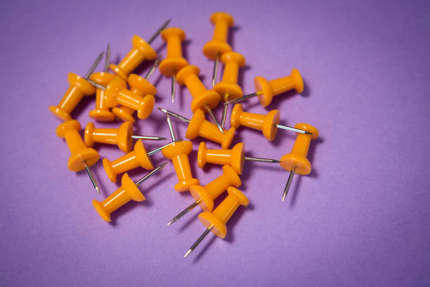 istock Yellow paper pins on paper 879949788