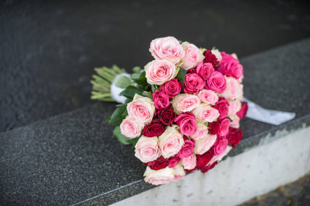 istock Wedding bouquet. Roses. Water and rain on background. 879956184