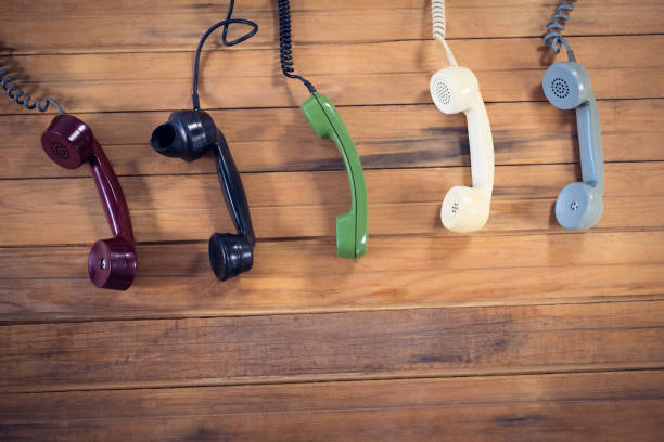 istock Overhead view of telephone receivers 879959250