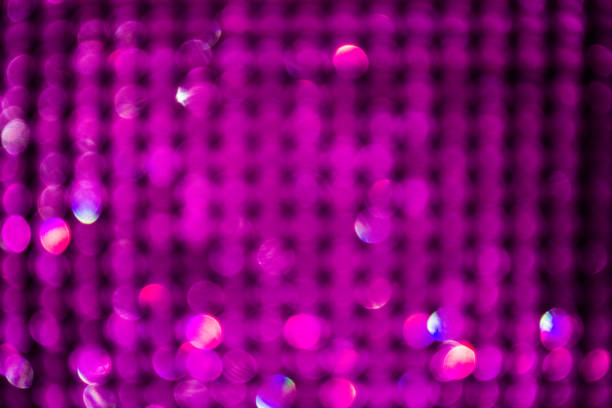 istock Magenta glitter vintage lights background. defocused 879961906