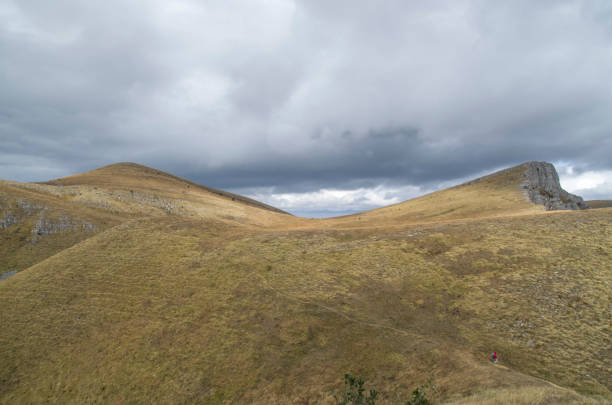 istock Storm clouds over mountains meadow in autumn 879965476