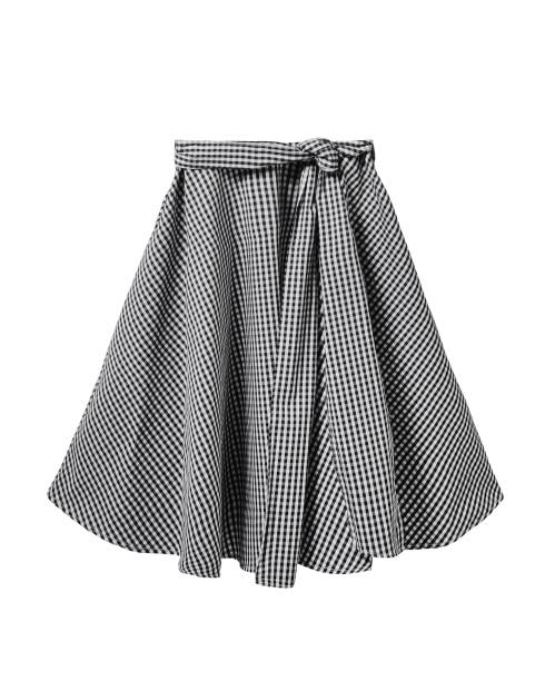 istock Black and white checkered skirt with long ribbon belt isolated on white 879969724