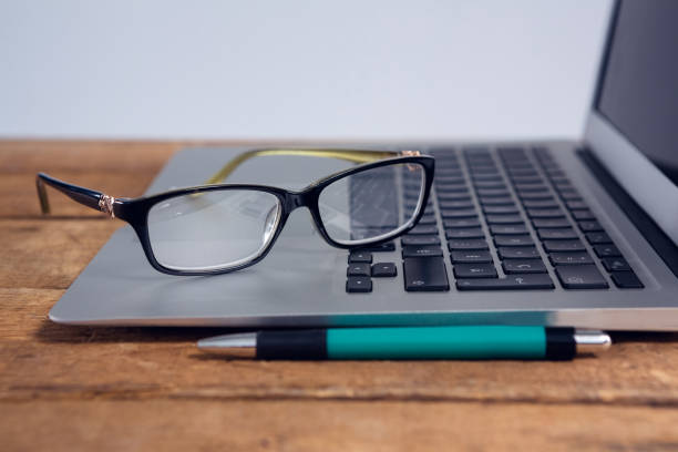 istock Close-up of spectacles on laptop 879986456