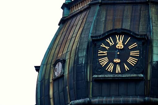 Old clock on medieval church tower, Saint Peters Lutheran church in Riga, Latvia