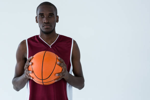 istock Confident player holding basketball 879994188