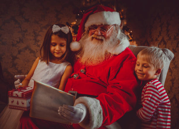 istock Santa reading fairy tales 879999876