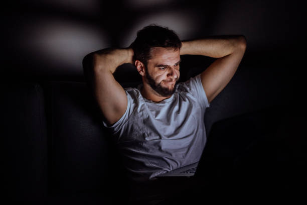 istock Unsatisfied man looking at his trade at cryptocurrency web wallet 880005270