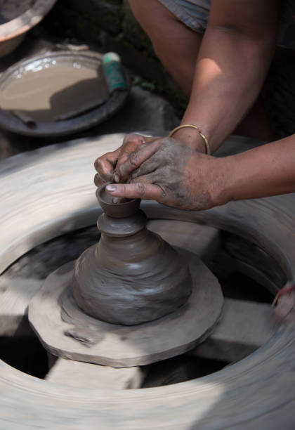 istock Potter throwing a clay pot on handmade pottery wheel Kathmandu Nepal 880008322