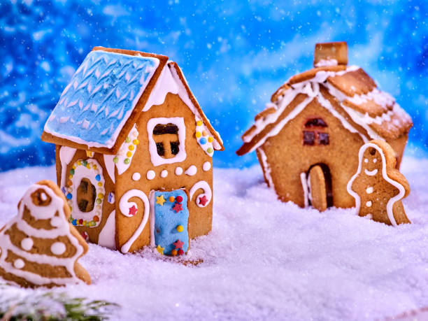 istock Two cookie houses and gingerbread man. 880011212