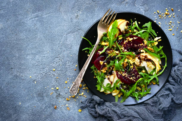 istock Vegetable salad with beetroot,apple,walnut and arugula leaves 880013808