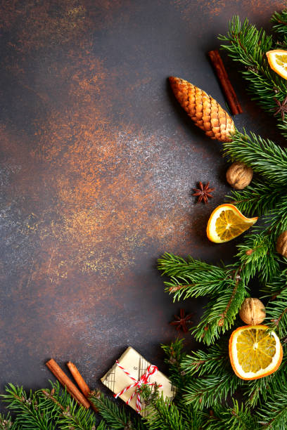 istock Dark brown christmas background with fir branches 880016054