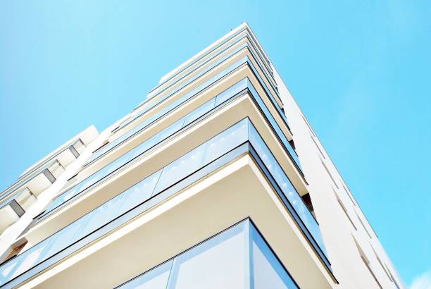istock Modern apartment buildings on a sunny day with a blue sky. 880023454
