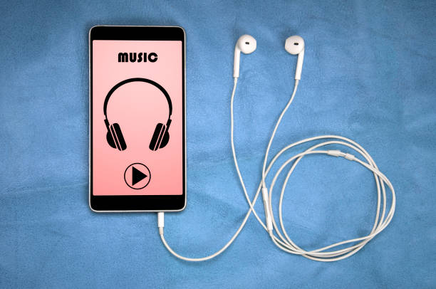 istock Headphones And Play Button On Smartphone Screen 880025616