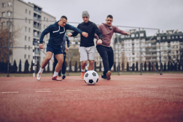 istock Friends Playing Soccer 880025886