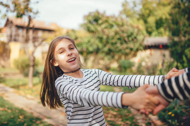 istock Girls Holding Hands And Spinning 880030718