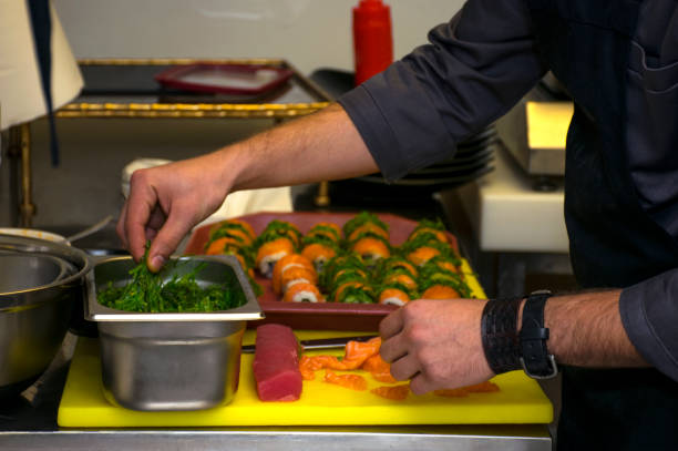 istock Preparing Japanese Sushi with salmon and seaweed 880030902
