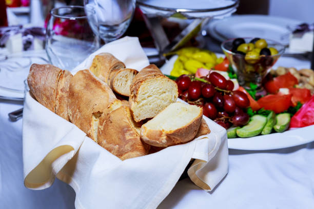 istock Pieces of bread on a basket in a restaurant 880038386