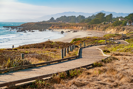 Landscape stock photograph of coastline with boardwalk at Moonstone Beach in Cambria, California, USA
