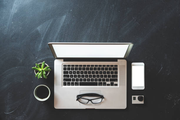 Desktop with white screen laptop and smartphone