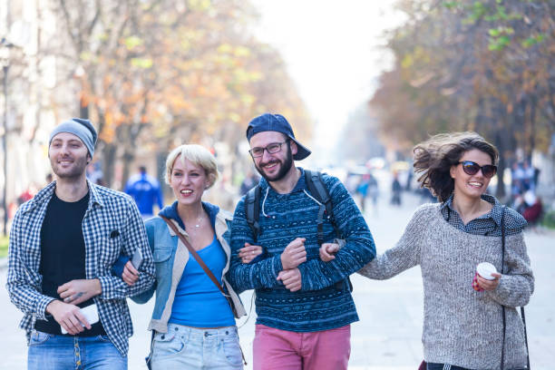 istock Friends holding hands and hanging out 880083842