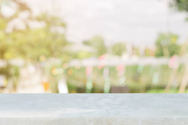 istock Stone board empty table in front of blurred background. Perspective brown stone over blur in coffee shop - can be used for display or montage mock up your products. vintage filtered image. 880084046