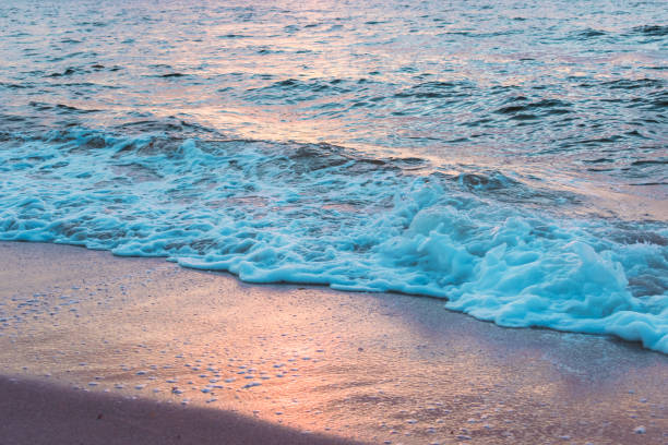 istock Background water texture - pink and blue ocean waves 880090202
