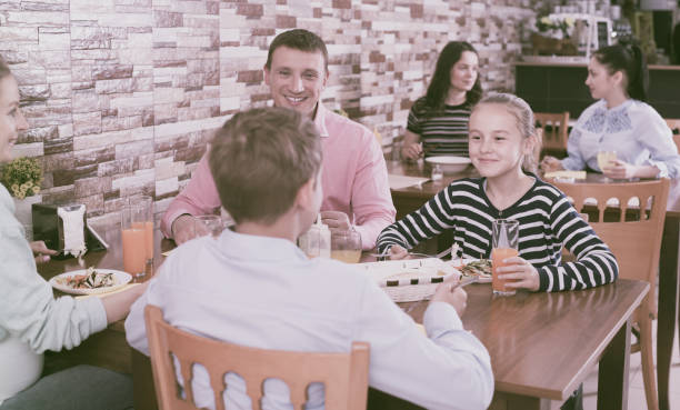 istock Family dining in cafe 880093088