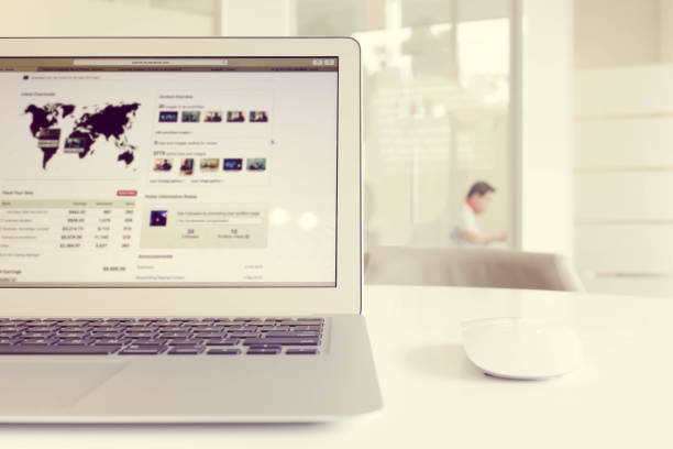 istock Laptop computer with officer in other side of room 880093218