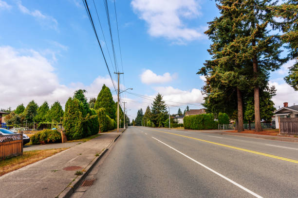 istock beautiful asphalt road in the suburbs with beautiful scenery 880093736