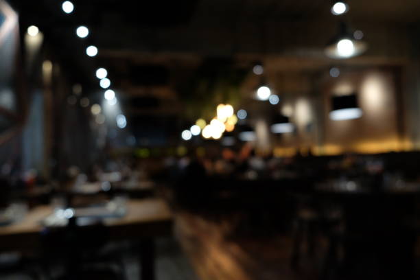 istock Coffee shop blur background with bokeh light with vintage filter 880124144
