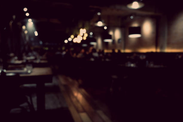 istock Coffee shop blur background with bokeh light with vintage filter 880124148
