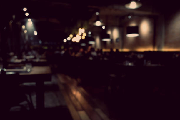 Coffee shop blur background with bokeh light with vintage filter stock photo