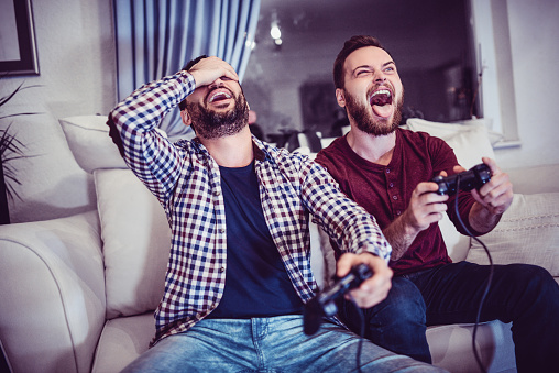 Handsome Man Is Defeating His Older Brother in Video Games