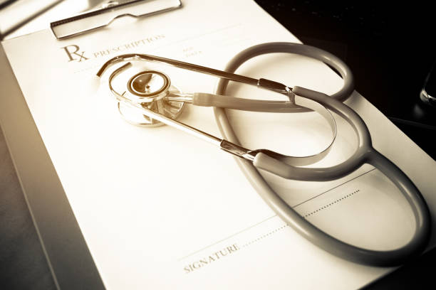 istock Stethoscope and record information paper folder on Laptop, smart phone at medicine doctor work, on blur patient in hostpital, Concept of Health Care and Medical. Selective focus. 880133748