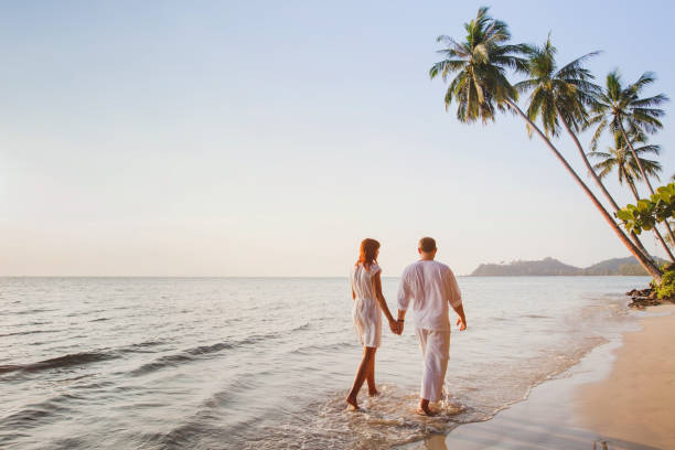 istock couple on the beach, romantic vacation, honeymoon 880133996