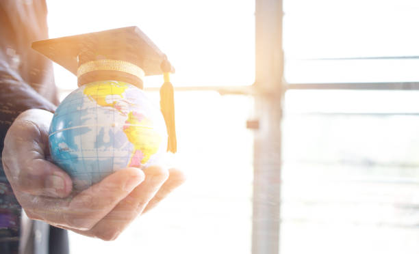 istock Education in Global, Graduation cap on Businessman holding Earth globe model map with Radar background in hands. Concept of global business, abroad educational, Back to School. 880134004