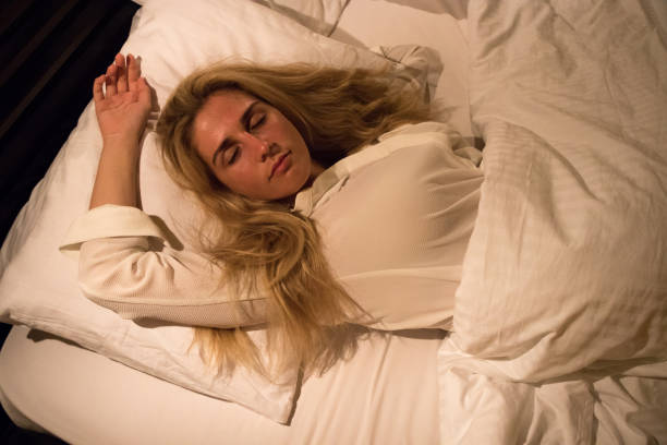 istock Girl sleeping in bed 880174422