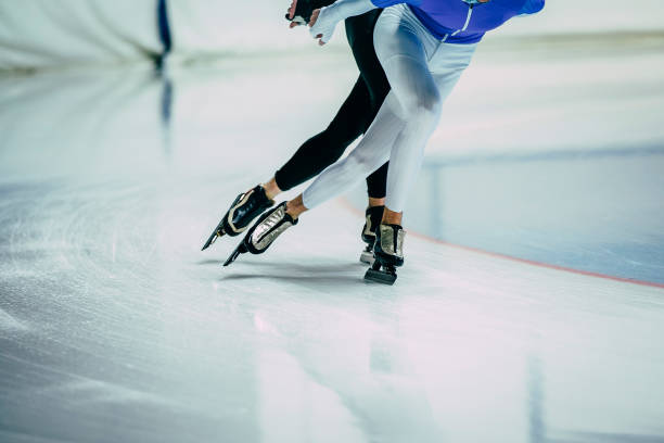 feet man athletes skater on ice go ice palace of sports. competitions indoors. warm-up - people cold frozen unrecognizable person imagens e fotografias de stock