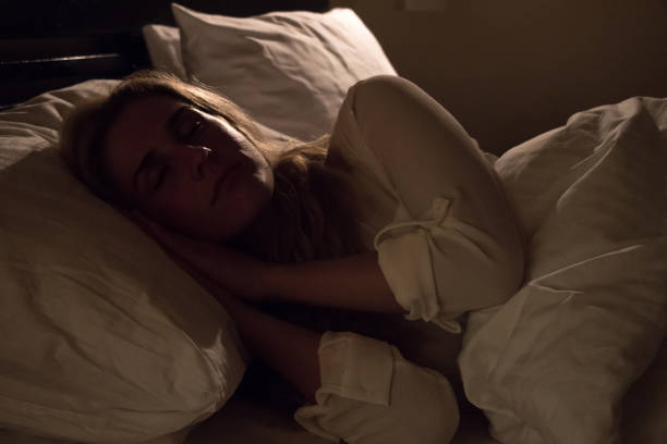 istock Girl sleeping in bed 880192566
