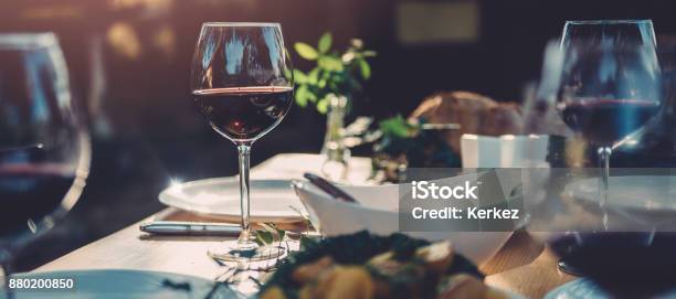 Glass Of Wine At Dining Table Stock Photo - Download Image Now - Wine, Restaurant, Dinner